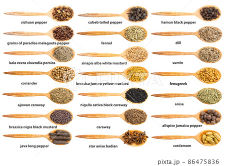 op view of wood spoon with various flavoring seeds 86475836