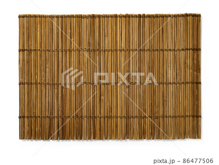 Brown bamboo table mat isolated on a white background. Brown bamboo table mat isolated on a white background. 86477506