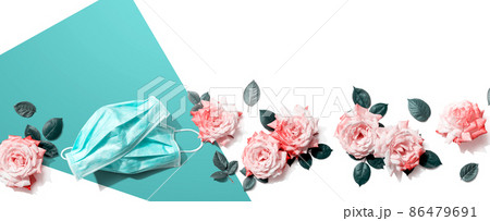 Face masks with pink roses overhead view Face masks with pink roses overhead view 86479691