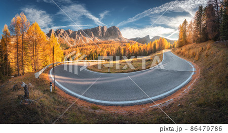 Winding road in mountains and orange trees at colorful sunset in autumn in Italy. Landscape Winding road in mountains and orange trees at colorful sunset in autumn in Italy. Landscape 86479786