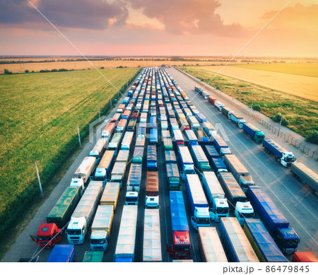 Aerial view of colorful trucks in terminal at sunrise in summer 86479845
