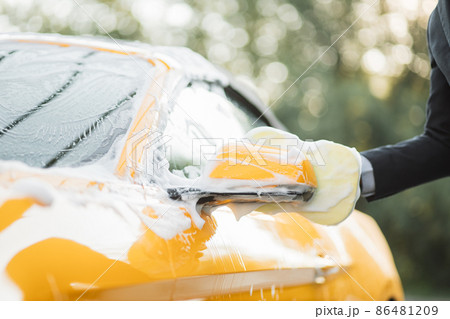 Luxury car covered by foam. Luxury car covered by foam. 86481209
