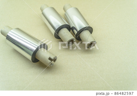 Thermal transfer ribbon - TTR. Wax thermo ribbon on cardboard reel for barcode. Supply material for printing industry. Selective focus 86482597