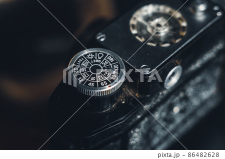 Soviet old film camera with manual lens. Retro photo equipment. Selective focus Soviet old film camera with manual lens. Retro photo equipment. Selective focus 86482628