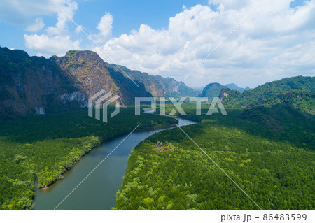 Aerial view drone shot of beautiful natural scenery river in mangrove forest and high mountains in phang nga province Thailand 86483599