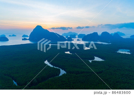 Aerial view drone shot of beautiful sunrise sky in the morning Drone flying over sea and mangrove forest Landscape High angle view Dynamic aerial shot Amazing nature view 86483600