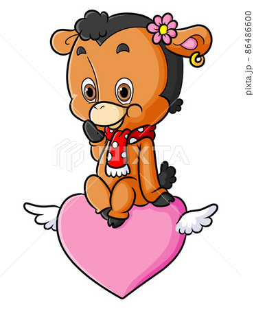 The cute happy sheep is sitting on the flying heart 86486600
