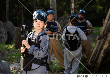 Portrait of young woman paintball player 86488404