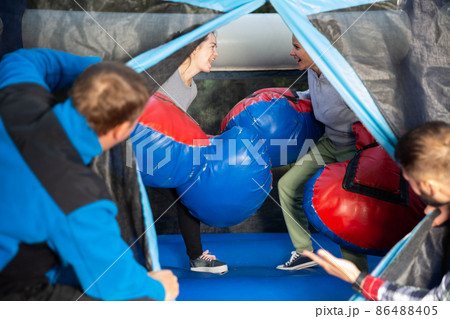 Women boxing on inflatable ring Women boxing on inflatable ring 86488405