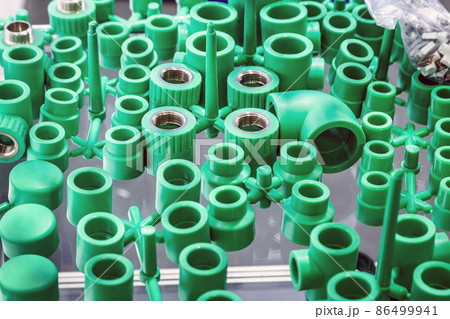 goods and parts made of plastic, fittings and adapters on the store counter 86499941