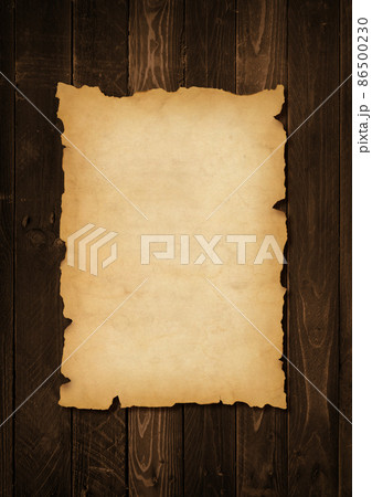 Old mediaeval paper sheet. Parchment scroll on a wood board 86500230