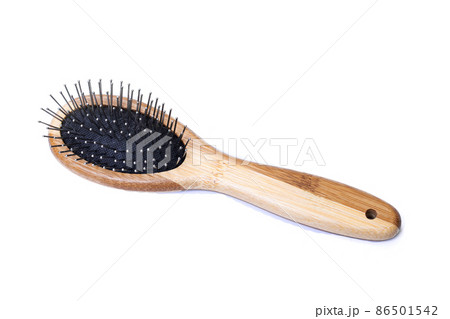 Wooden comb isolated on a white background 86501542