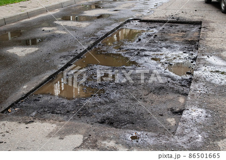 Hole on pavement on road during repairs 86501665