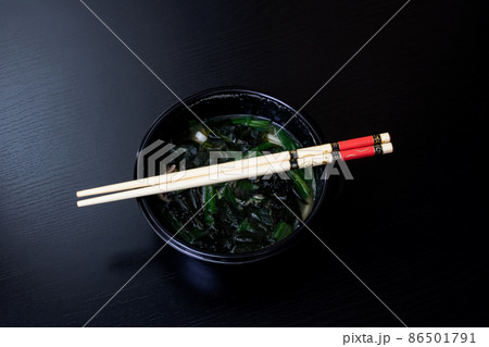 Japanese soup and sticks on wooden table 86501791
