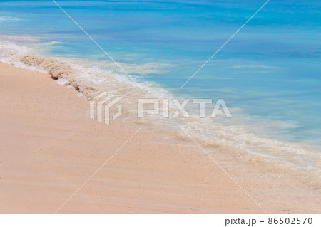 Soft wave of ocean on sandy beach 86502570
