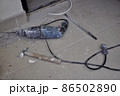 Hammer, chisel and electric drill lying on the tile floor. Renovation. Home improvement. Do It Yourself apartment repairing.  86502890