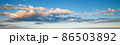 Blue sky with clouds in sunset light panorama 86503892
