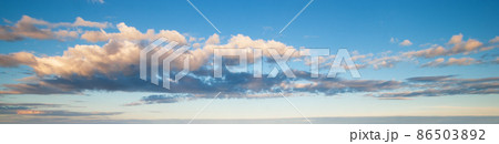 Blue sky with clouds in sunset light panorama Blue sky with clouds in sunset light panorama 86503892