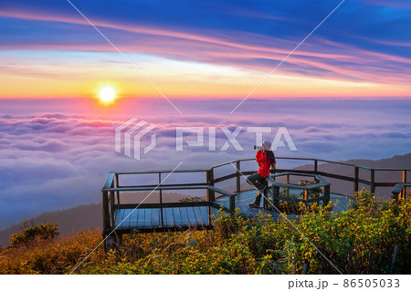 Tourist enjoying sunset at Kew Mae Pan viewpoint in Doi inthanon, Chiang Mai, Thailand. Tourist enjoying sunset at Kew Mae Pan viewpoint in Doi inthanon, Chiang Mai, Thailand. 86505033