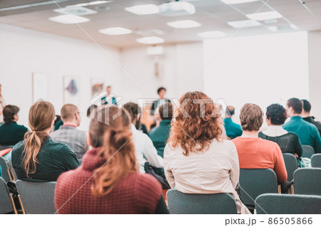 Speaker giving a talk at business meeting. Audience in conference hall. Business and entrepreneurship symposium. 86505866