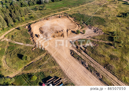 Removal of overburden on a piece of land before sand pit mining Removal of overburden on a piece of land before sand pit mining 86507050