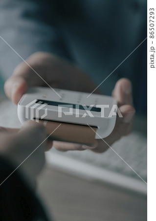 inserting a credit card into a payment terminal inserting a credit card into a payment terminal 86507293