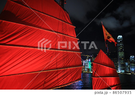 Chinese red junk with the victoria harbor night view background in hong kong 86507935