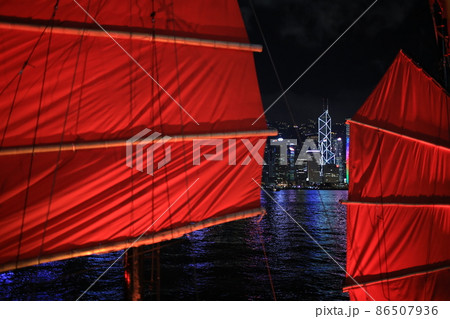 Chinese red junk with the victoria harbor night view background in hong kong 86507936
