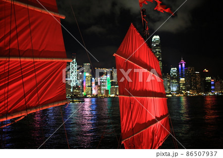 Chinese red junk with the victoria harbor night view background in hong kong 86507937