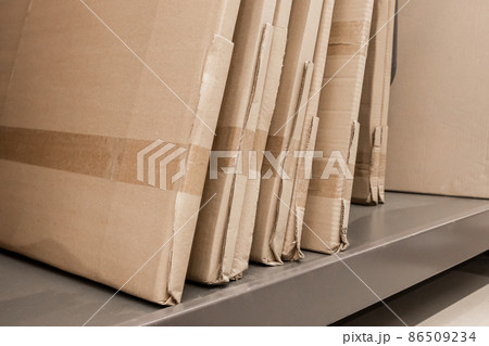 Supply of building materials objects on the store shelf products and construction goods packed in cardboard Supply of building materials objects on the store shelf products and construction goods packed in cardboard 86509234