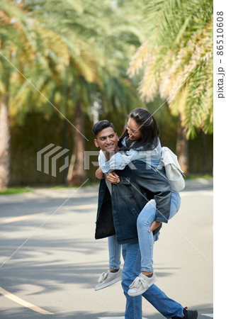 Man Giving Piggyback Ride To His Girlfriend Stock Photo - Image of  cheerful, person: 41022350