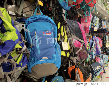 PENANG, MALAYSIA -16 JUNE 2021: Selected focused on various types of travel bags sold in a supermarket. Comes in a variety of designs and colors, as well as marked with a price tag. PENANG, MALAYSIA -16 JUNE 2021: Selected focused on various types of travel bags sold in a supermarket. Comes in a variety of designs and colors, as well as marked with a price tag. 86510868