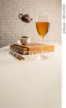 tea table with appliances and wine glasses, in which large-leaf tea is brewed 86510987