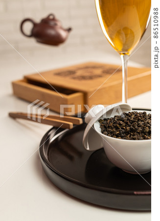 tea table with appliances and wine glasses, in which large-leaf tea is brewed 86510988