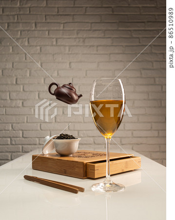 tea table with appliances and wine glasses, in which large-leaf tea is brewed 86510989