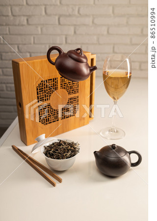 tea table with appliances and wine glasses, in which large-leaf tea is brewed tea table with appliances and wine glasses, in which large-leaf tea is brewed 86510994