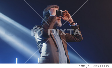 Creator in virtual reality glasses at a conference 86513349