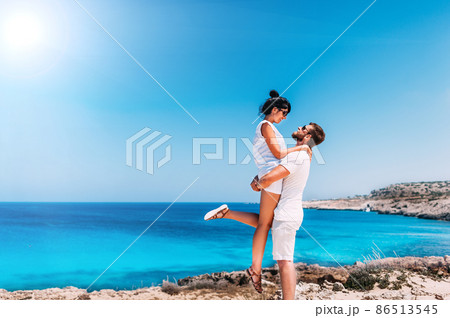 Happy couple by the sea. Man and woman having fun on the sea. Honeymoon lovers. Man and woman on the island. Couple in love on vacation. Sea tour. Honeymoon trip. Couple in love at the blue lagoon 86513545