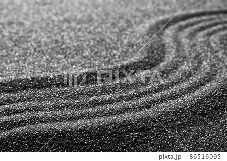 Pattern on decorative black sand, closeup. Zen and harmony 86516095