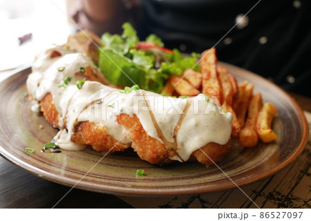 close up of chicken stripe and sauce on table close up of chicken stripe and sauce on table 86527097