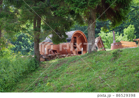 Wooden barrel sauna in the garden. Tree Wooden barrel sauna in the garden. Tree 86529398