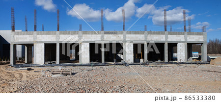 Construction of a building, construction site. Blue sky. 86533380