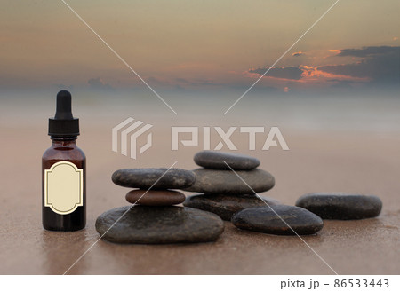 Fitotherapy, bottle on the sand.. 86533443