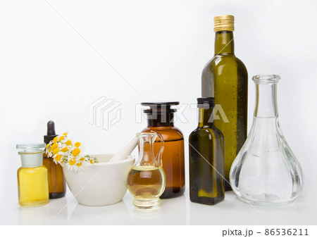 Set bottles of essential oil, white background. Healthy cosmetics concept. Set bottles of essential oil, white background. Healthy cosmetics concept. 86536211