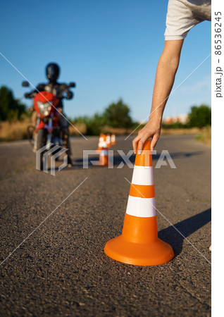 Snake riding between the cones, motorcycle school Snake riding between the cones, motorcycle school 86536245
