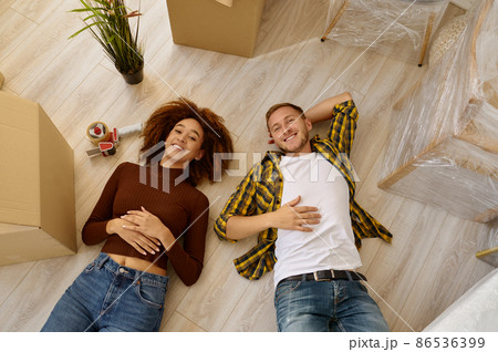 Happy couple on floor view from above Happy couple on floor view from above 86536399
