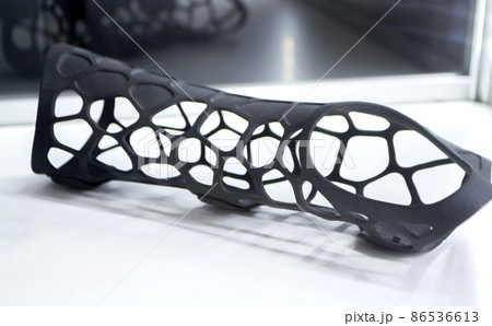 Black orthopedic plastic prosthesis printed on powder 3D printer for hand. Black orthopedic plastic prosthesis printed on powder 3D printer for hand. 86536613