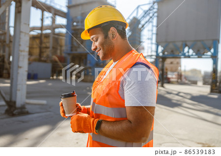 Skillful multiethnic foreman working at construction plant 86539183