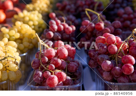 Grapes close-up. Selective and soft focus. Ripe and juicy grapes are sold at the farmers bazaar Grapes close-up. Selective and soft focus. Ripe and juicy grapes are sold at the farmers bazaar 86540956