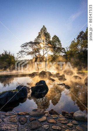 Hot springs and fog in Thailand with sunlight at morning, Sunrise above hot spring nature background, Hot springs in Chae Son National Park, Lampang, Thailand. Hot springs and fog in Thailand with sunlight at morning, Sunrise above hot spring nature background, Hot springs in Chae Son National Park, Lampang, Thailand. 86547535